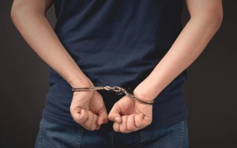 arrested-man-handcuffs-handcuffed-hands-260nw-2463623513-b25df9.jpg